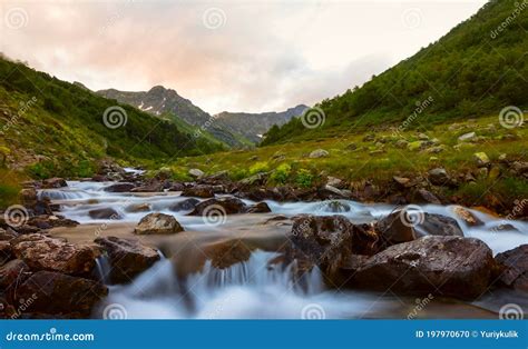 River Rushing Over A Green Mountain Valley Stock Photo Image Of