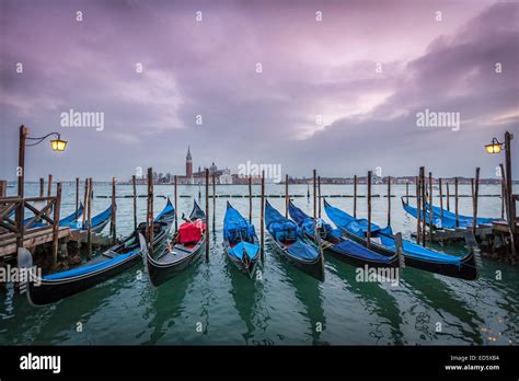 Venice Gondolas Moored By Saint Marks Square With View Of Saint
