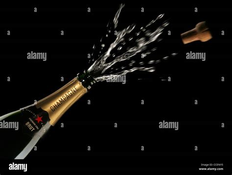 Opening a Champagne Bottle Stock Photo - Alamy
