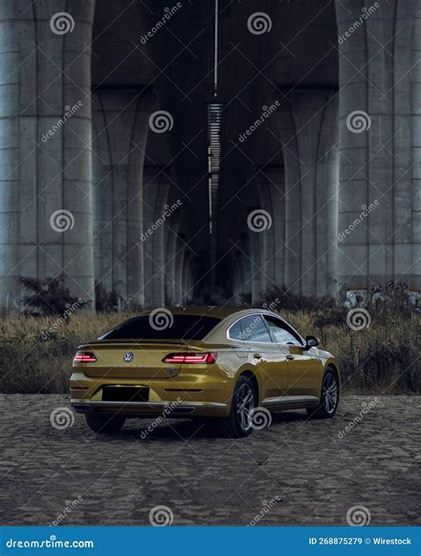 Vertical Shot Of A Volkswagen Arteon Gold Color Editorial Stock Image