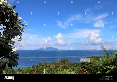 Blue Skies Over Silhouette Island Stock Photo Alamy