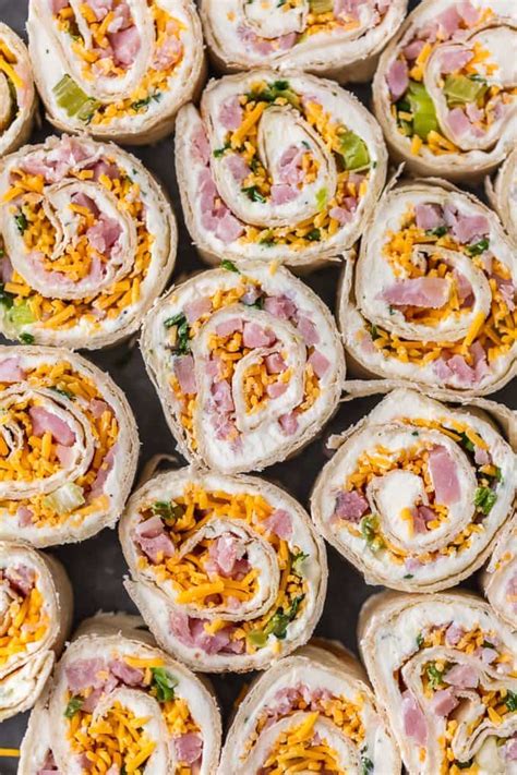 Trim tortilla along the long sides of the ham and roll from bottom to top. Ham and Cheese Roll Ups (Tortilla Roll Ups) - The Cookie ...