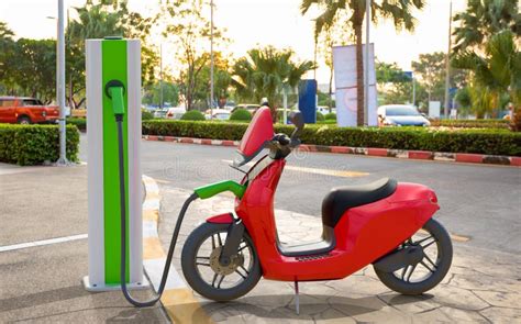 An Electric Scooter Charging At Power Station Stock Photo Image Of