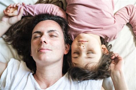 Mother And Daughter Closed Eyes Lying In Bed Stock Image Image Of