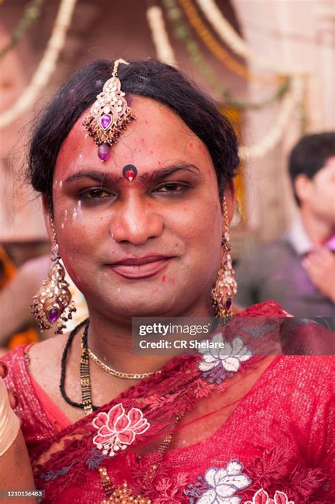 transgender or hijra smear themselves with colors during the lathmar holi festival barsana india