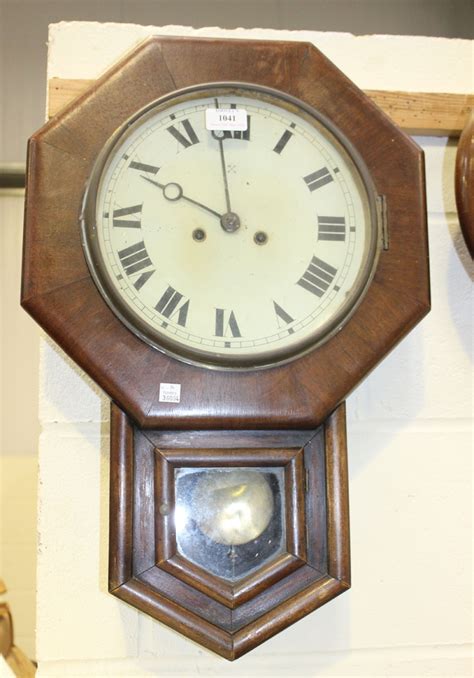 A Late 19thearly 20th Century German Walnut Octagonal Drop Dial Wall Clock With Eight Day Movement