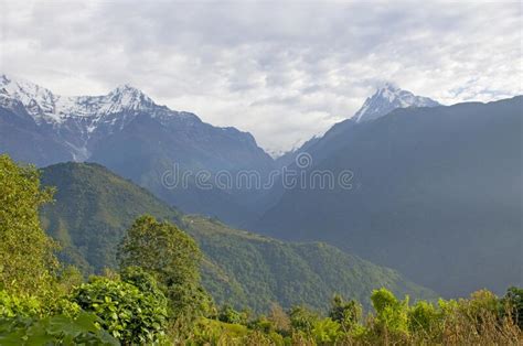 The Peaks Of The Mountains Of Nepal Among The Trees Are The Landscape