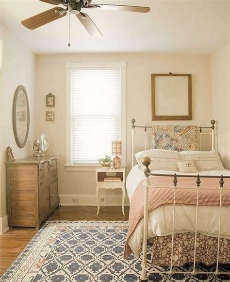 A Bed Room With A Neatly Made Bed And A Ceiling Fan