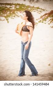Woman Wearing Jeans Topless On Beach Stock Photo 141459484 Shutterstock