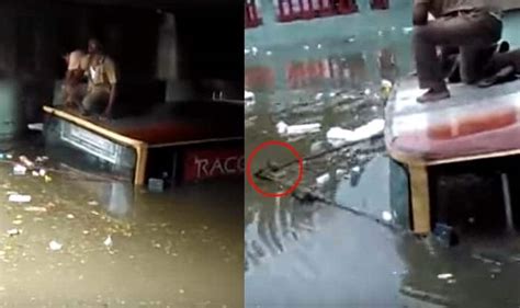 chennai citizens dramatically pull out a submerged bus from flooded subway video