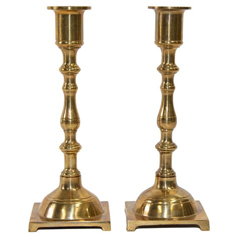 Pair Of Square Base Brass Candlesticks With Slide Ejectors At 1stdibs