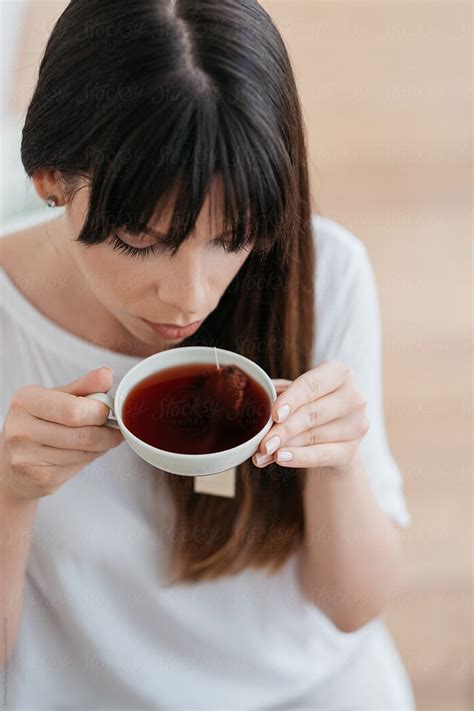 Young Woman Drinking Tea By Stocksy Contributor Branislava Živić Stocksy