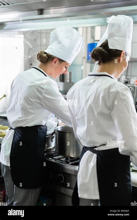 Female Chefs Working In Industrial Kitchen Stock Photo Alamy