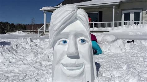 Time Lapse Of Snow Sculpture Creation Including Painted Wood Eyes