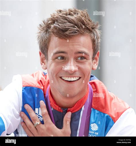 diver tom daley reacts during the olympic and paralympic parade of athletes through central