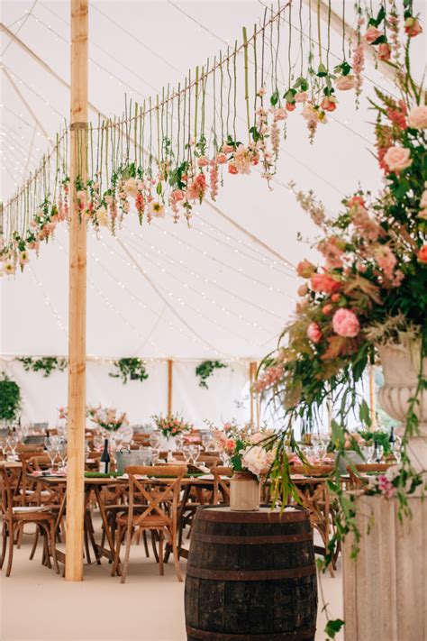 chris and gemma s floral spring traditional marquee wedding one six events hanging flowers