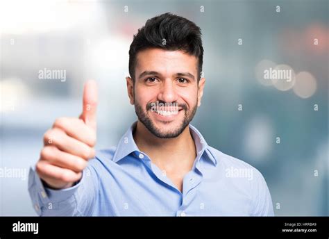 Portrait Of A Smiling Business Man Giving Thumbs Up Stock Photo Alamy