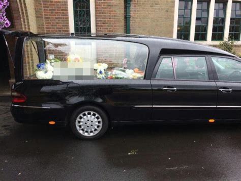 Mourners Stunned As Hearse Arrives At Funeral With Floral Tribute Reading C And