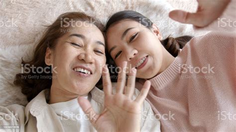 Pov Retired Healthy Mom And Girl Two People Hold Phone Waving Hand
