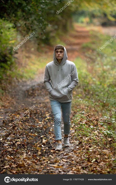 Teenage Boy Walking Alone On An Atumn Day Stock Photo By ©triumph0828