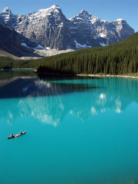 Two People On Boat In Lake During Daytime Banff National Park Moraine