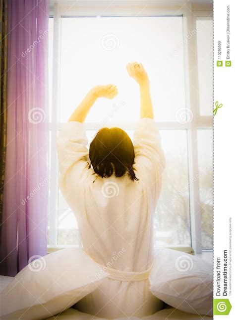 The Woman Is Stretched Out In Bed Stock Image Image Of Morning