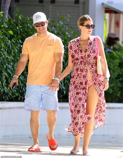 mark wahlberg and rhea durham flaunt fit physiques and pack on the pda during swim in barbados