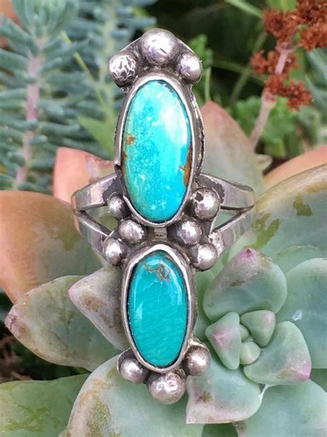vintage southwestern sterling silver ring set with natural turquoise stones the turquoise has