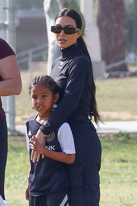 Kim Kardashian Snuggles Son Saint At His Soccer Game Pics Hollywood Life