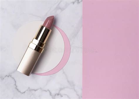 Nude Pink Lipstick On Creative Polka Dot Beige Background Stock Image