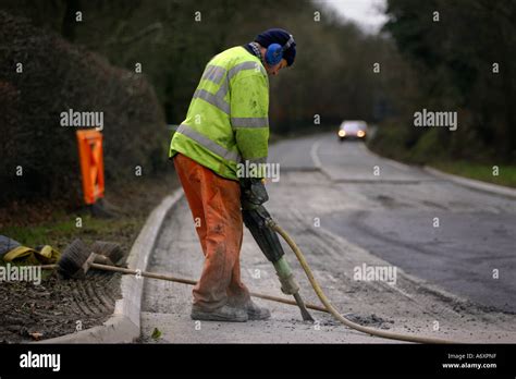 Road Worker Digging Up Tarmac Stock Photo Royalty Free Image 6666974