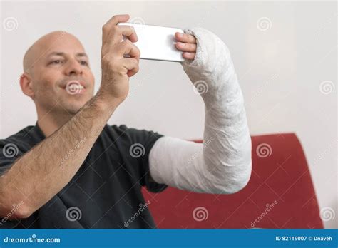 Young Man With An Arm Cast Taking A Selfie Stock Image Image Of
