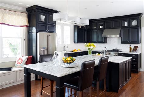 This transitional kitchen features a glass and marble backsplash, quartz composite counter and traditional hardware. Ten Key Kitchen Design Elements for 2020-2021 by Jan ...