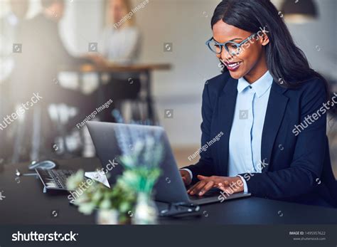 Smiling Young African American Businesswoman Working Stock Photo