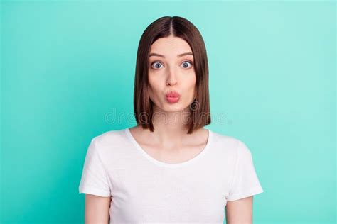 portrait of attractive girlish affectionate girl sending air kiss isolated over bright teal