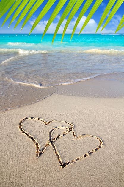 Premium Photo Hearts In Love Written In Caribbean Beach Sand