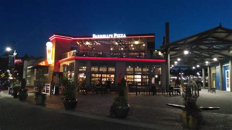 The Outside Of A Restaurant Lit Up At Night