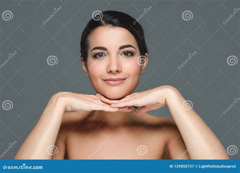 Portrait Of Attractive Brunette Woman With Bare Shoulders Looking At