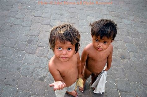 Two Hungry Street Children Boys Living In Poverty Are In Need Of Food