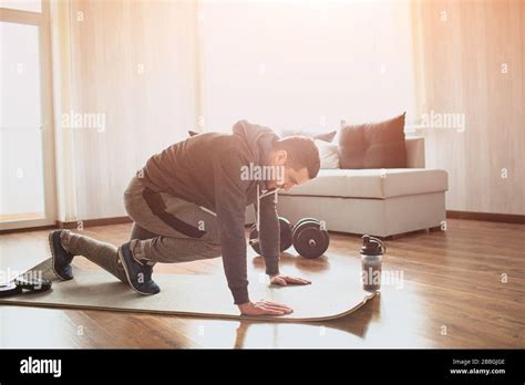 Young Ordinary Man Go In For Sport At Home Picture Of Real Ordinary Man Doing Abs Exercising By