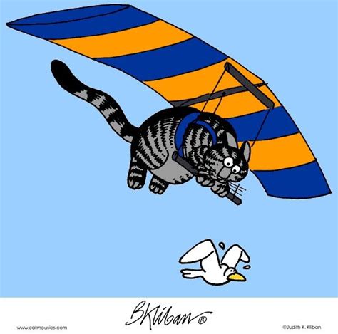 A Cat That Is Flying Through The Air With A Kite