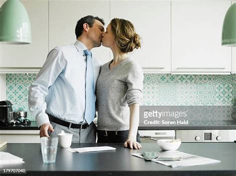 Couple Making Out In Kitchen Photos And Premium High Res Pictures