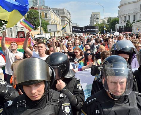 riot police protect kiev pride march as homophobic protestors burn lgbt flags daily star