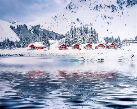 Wooden Red Houses Of Justad Fishing Village Reflected In The Calm