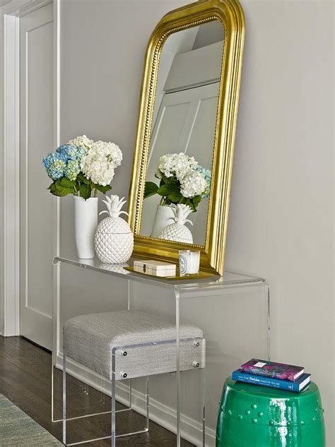Cb2 Peekaboo Acrylic Console Table With Gold Beaded Arch Mirror