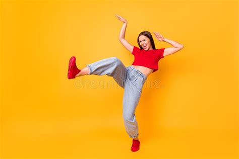 Full Size Photo Of Crazy Dancing Lady Raise Leg Youth Moves Wear Red Crop Top Jeans Isolated