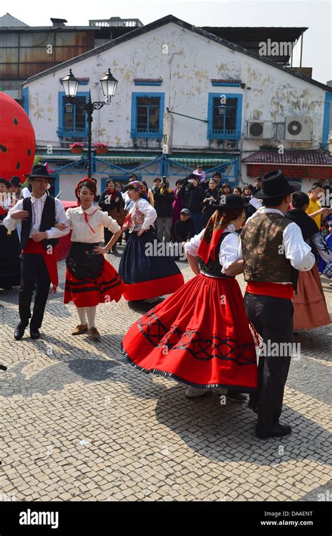 Dancers In Traditional Portuguese Dress Take Part In Folk Dancing At