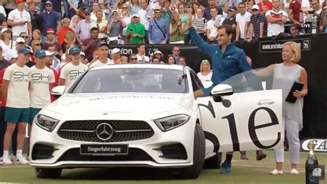 What would you do if you have a lot of money, well, roger federer know what. Roger Federer sits in new luxury car during Stuttgart ...