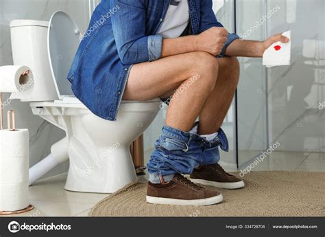 Man Holding Toilet Paper Blood Stain Rest Room Closeup Hemorrhoid Stock