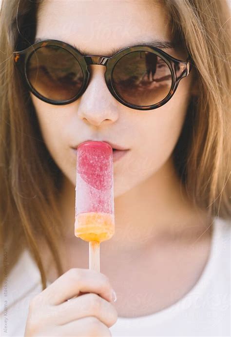 Young Woman Eating A Ice Cream By Stocksy Contributor Alexey Kuzma